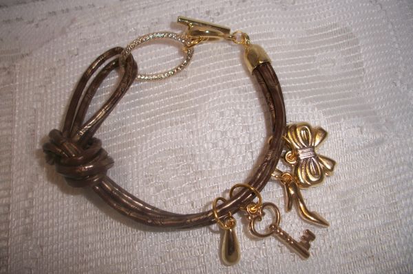 PULSEIRA DE COURO MARROM DOURADA